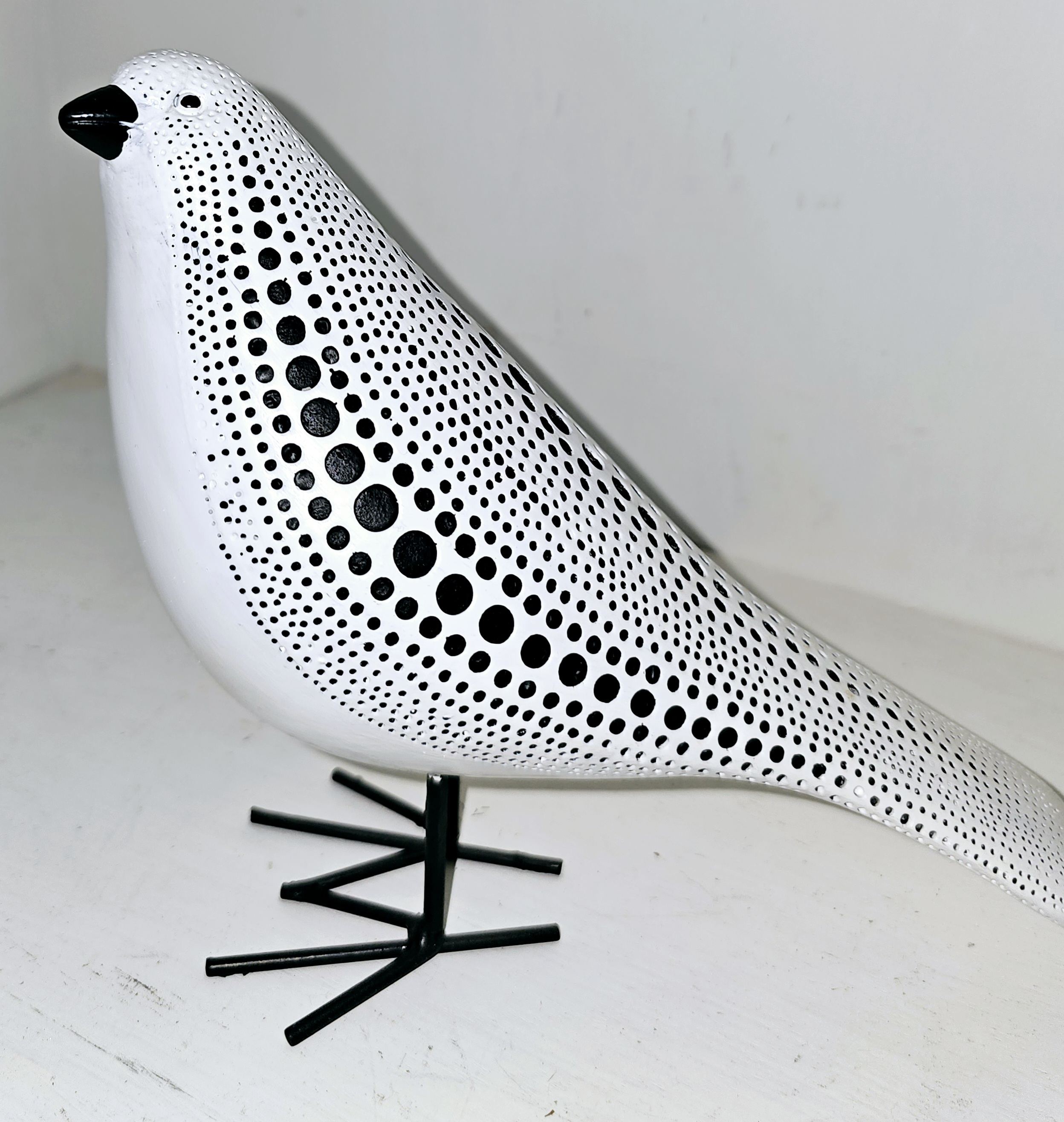 Dotted white and black bird